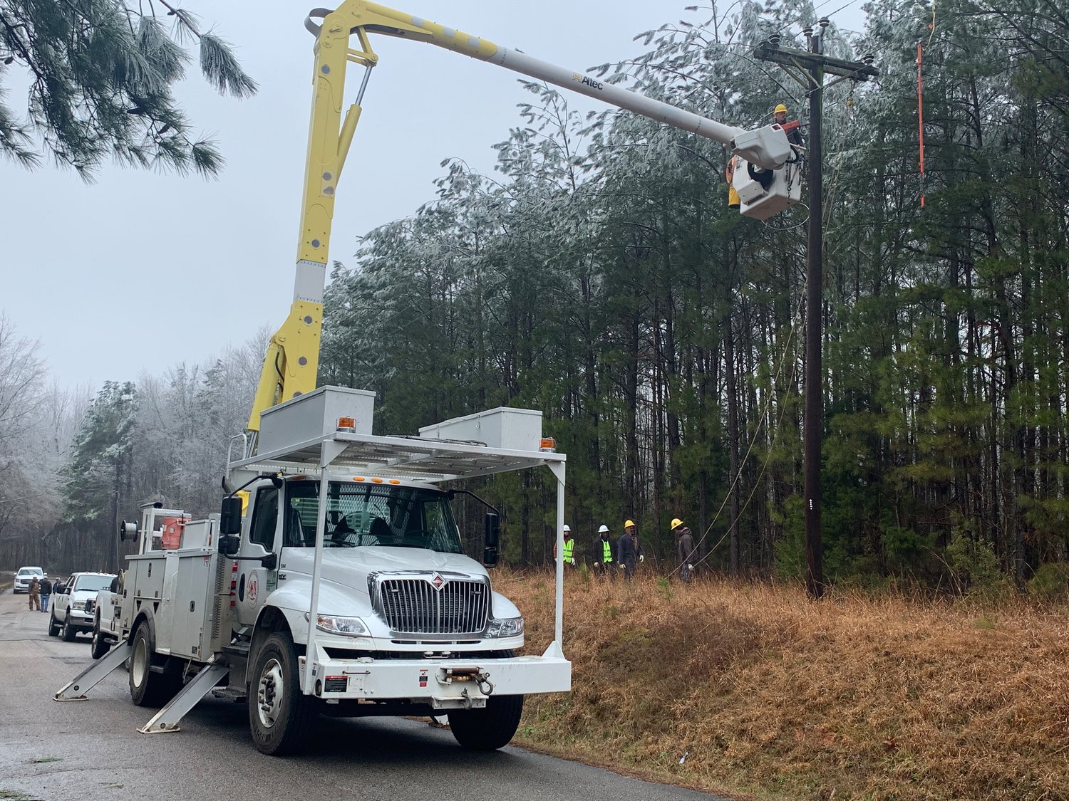 EMEPA crews work to restore power throughout parts of Kemper County following the winter storm that barrelled through Mississippi last week, causing a number of outages.