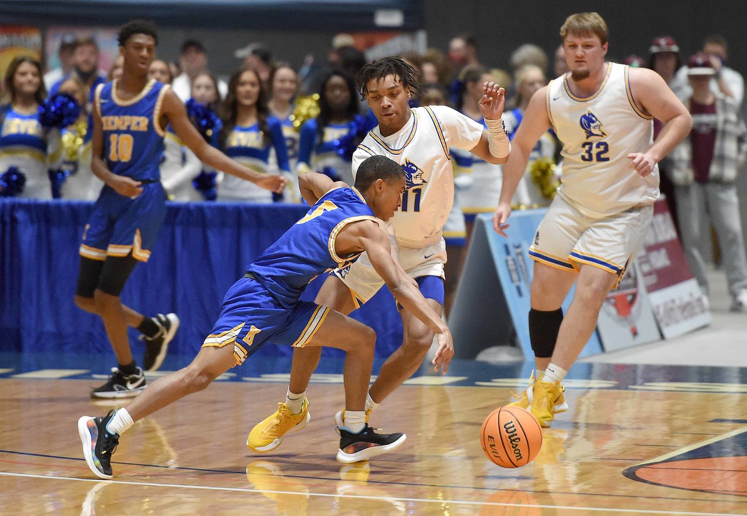 Kemper County's Alfred Love (5) drives against Booneville's L.J. Shumpert at the MHSAA State Basketball Tournament  semifinals on Wednesday, March 3, 2021, at the Mississippi Coliseum in Jackson, Miss.