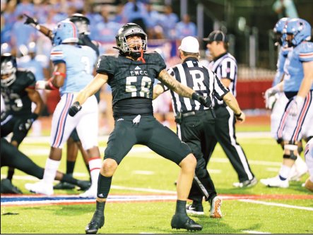 EMCC defensive lineman Trey Laing celebrates a tackle for a loss on a big fourth-down play earlier this season.