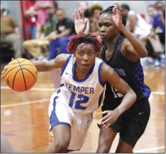 aylan Clayton (12) dribbles her way to the basket for the Wildcats during Kemper County's loss to Quitman in the Sam Dale Tournament.