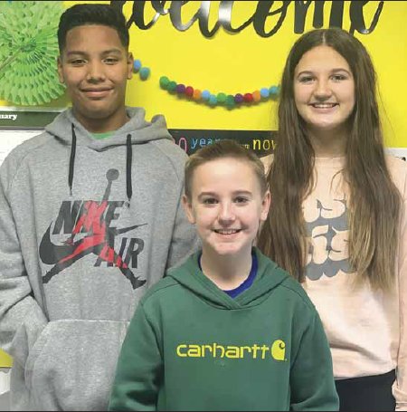 Hayes McDade, front, Tayshaun Chickaway, back left, and Abagail Williams will travel to Jackson Friday to represent Kemper Academy in the MAIS statewide spelling bee.