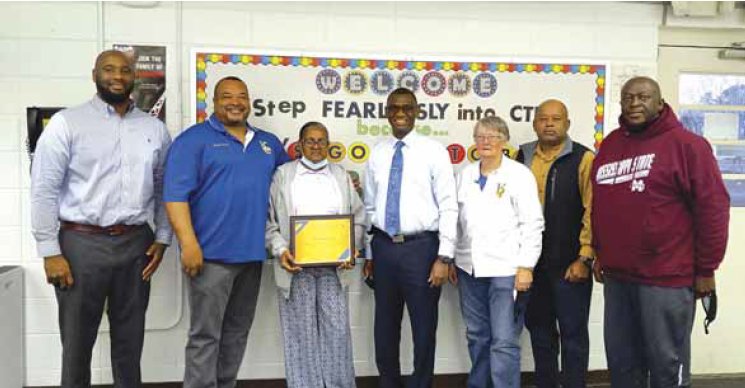 MargueriteWard, School Food Service Manager, (pictured center) was honored with a plaque upon her retirement. Pictured (l-r): Superintendent Hilute Hudson, Tyrone Steele, Ward, Rontal Jenkins, Carolyn Palmer, Lee Steele and James Creer.