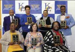 Teachers/Employees of the Year, (seated l-r): Rosalind Lanier, Food Service Worker; Theresa Savell, Upper Elementary; Paulette Jones, Lower Elementary. Standing l-r: Melvin Rush, Transportation; Betty Casey, High School; Shana Hopkins, Middle School; Juawn Jones, Success School. Not pictured: Thomas F. Thomas, CTE & District Teacher of the Year.