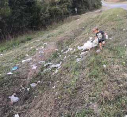 Kason Clay, the three-and-a-half year old son of Zac and Sidney Clay, hard at work helping to pick up trash along Shiloh Church Road in Kemper County.